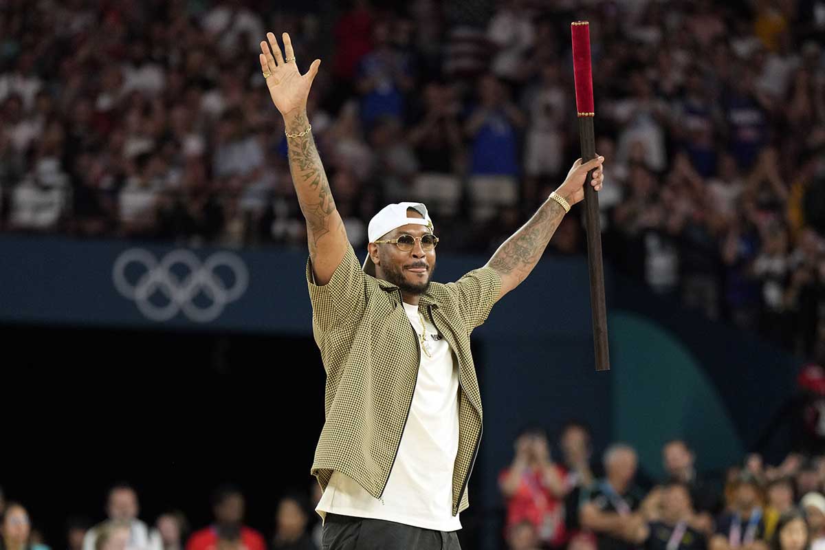 Carmelo Anthony performs before a men’s basketball quarterfinal game between the United States and Brazil during the Paris 2024 Olympic Summer Games at Accor Arena. 