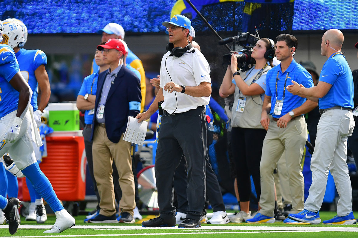 Los Angeles Chargers head coach Jim Harbaugh watches game action against the Los Angeles Rams during the first half at SoFi Stadium. 