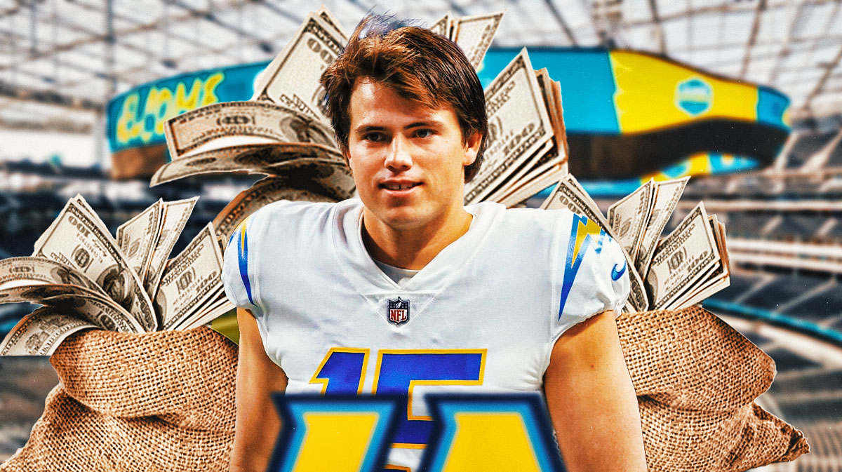 Cameron Dicker in Chargers gear smiles with moneybags around him