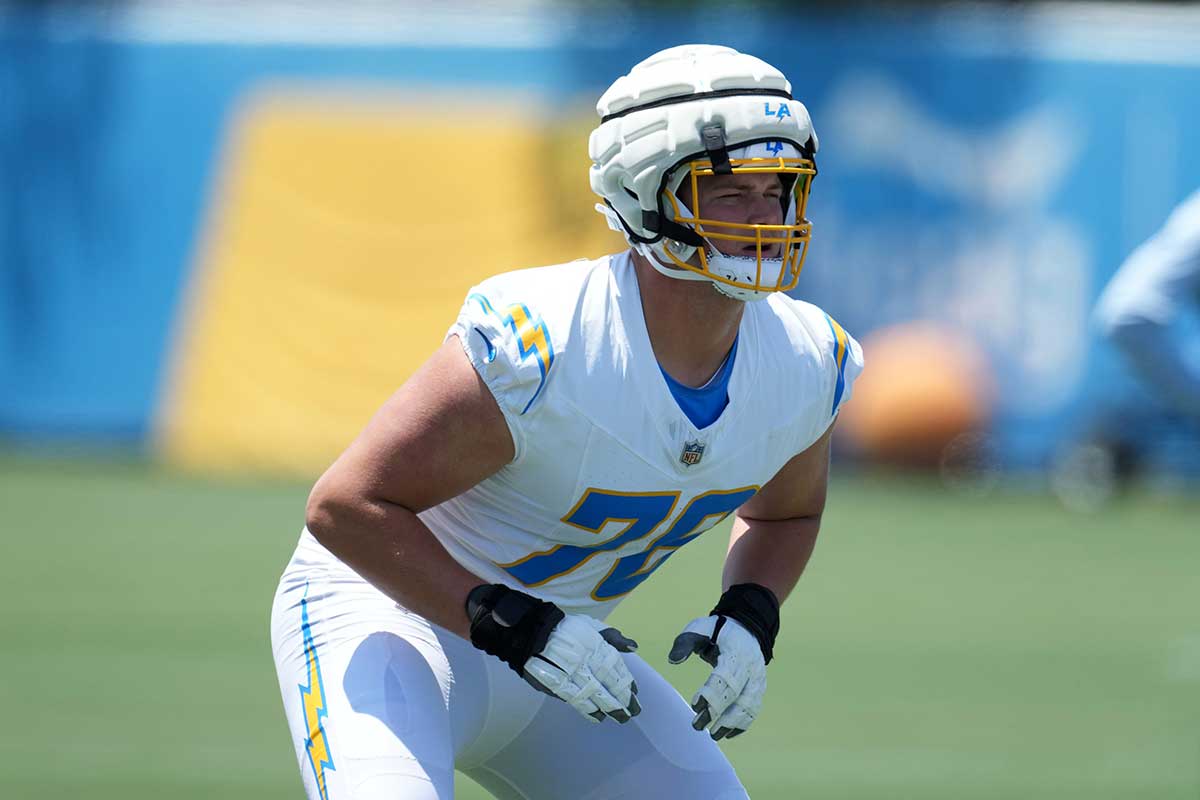 Los Angeles Chargers offensive tackle Joe Alt (76) wears a Guardian helmet cap during organized team activities at Hoag Performance Center.