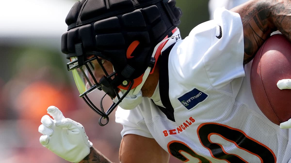 Cincinnati Bengals running back Chase Brown (30) returns a kick off during training camp practice at Kettering Health Practice Fields.