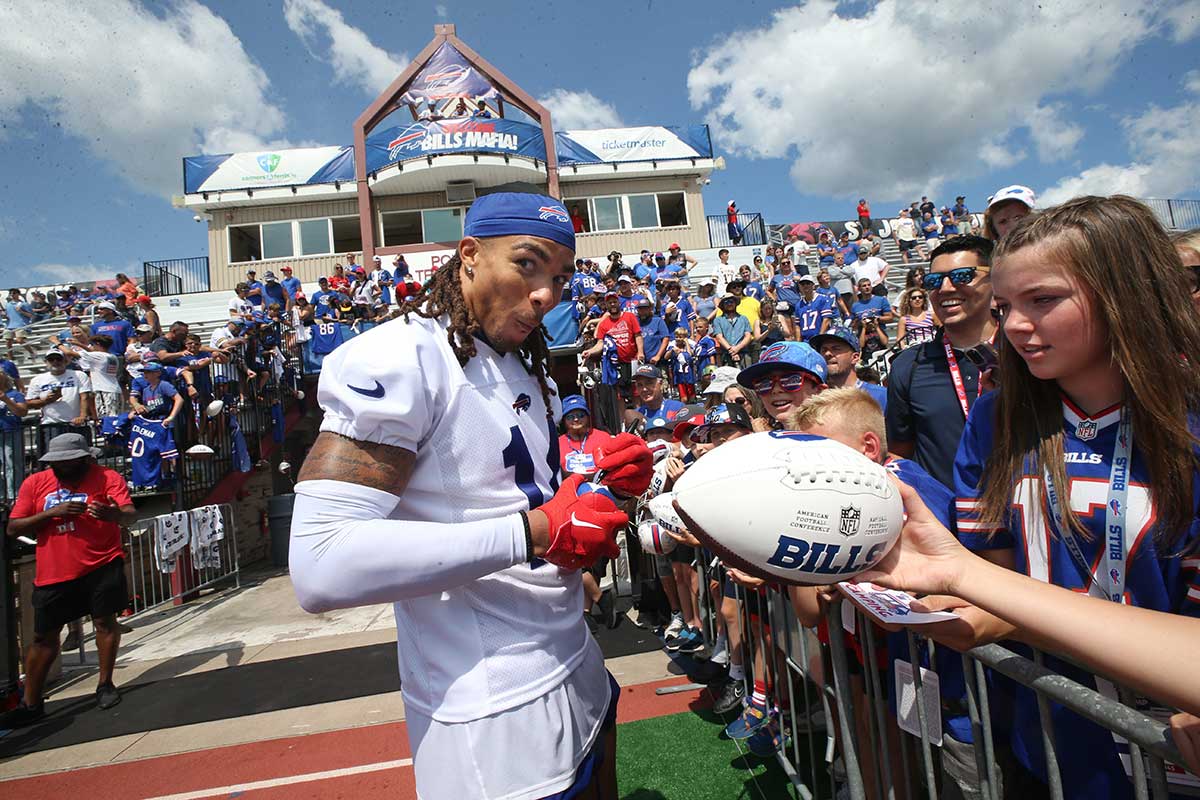 Bills wide receiver Chase Claypool signs autographs for fans.