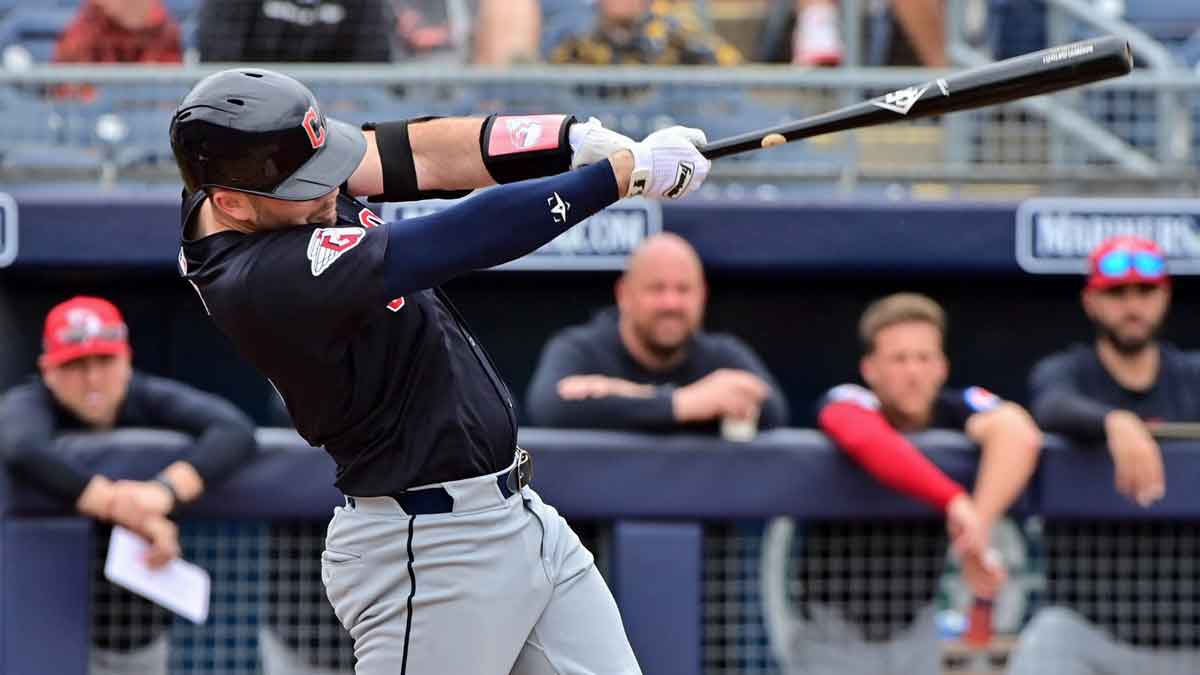 Feb 26, 2024; Peoria, Arizona, USA; Cleveland Guardians right fielder Chase DeLauter (6) hits a two run home run in the second inning against the San Diego Padres during a spring training game at Peoria Sports Complex.