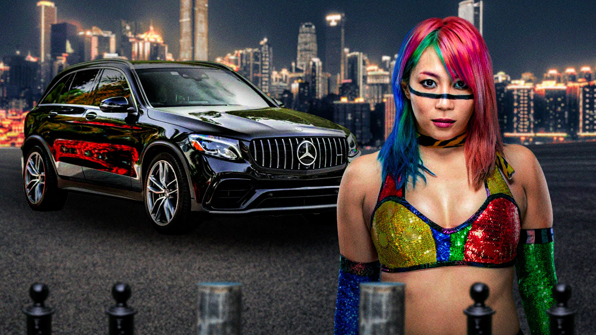 Asuka in front of a car from her collection.