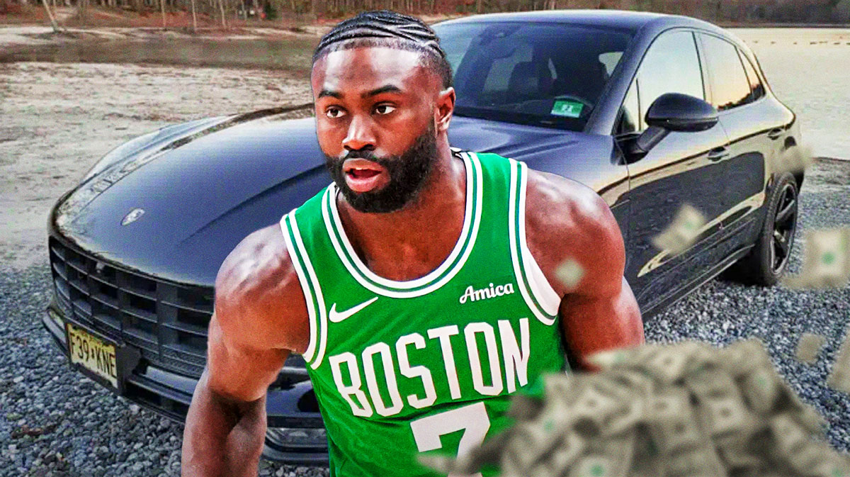 Jaylen Brown in front of a car from his collection.