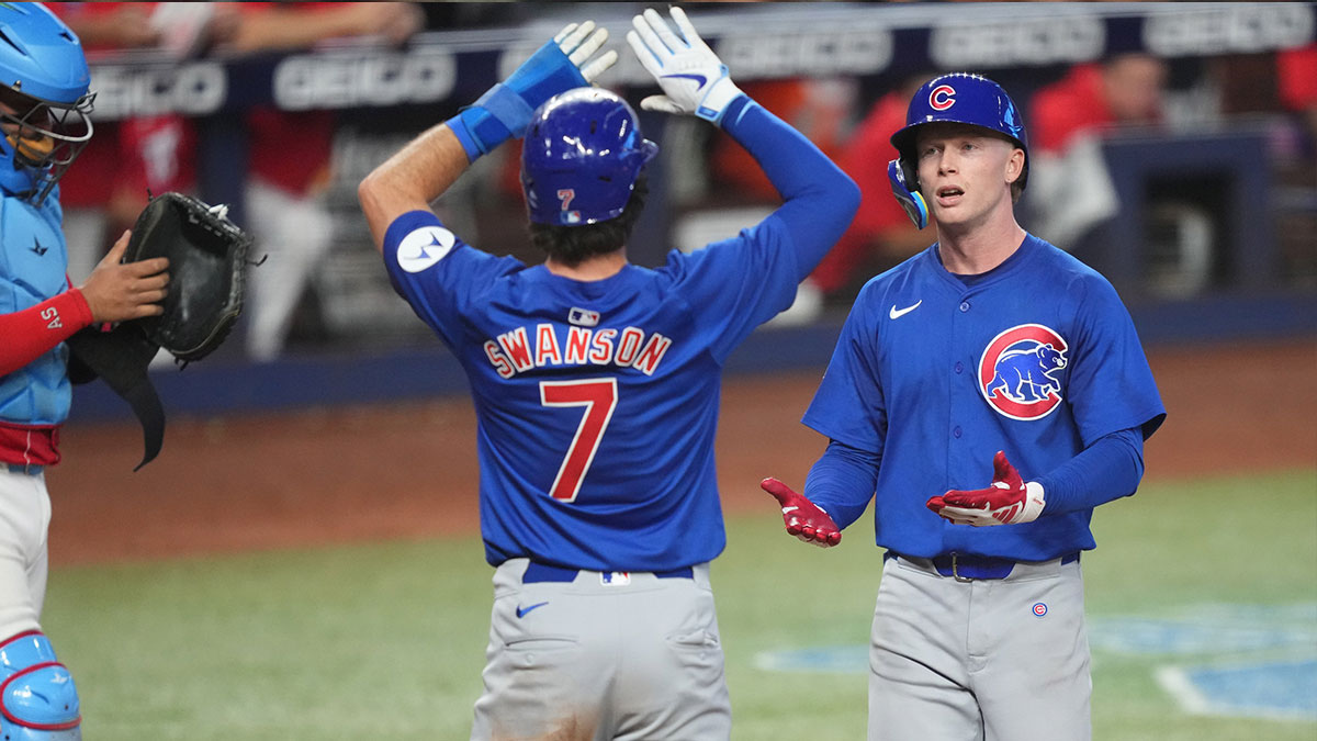Chicago Cubs center fielder Pete Crow-Armstrong, right, is congratulated by shortstop Dansby Swanson (7) after hitting a two-run home run in the fifth inning against the Miami Marlins at loanDepot Park.