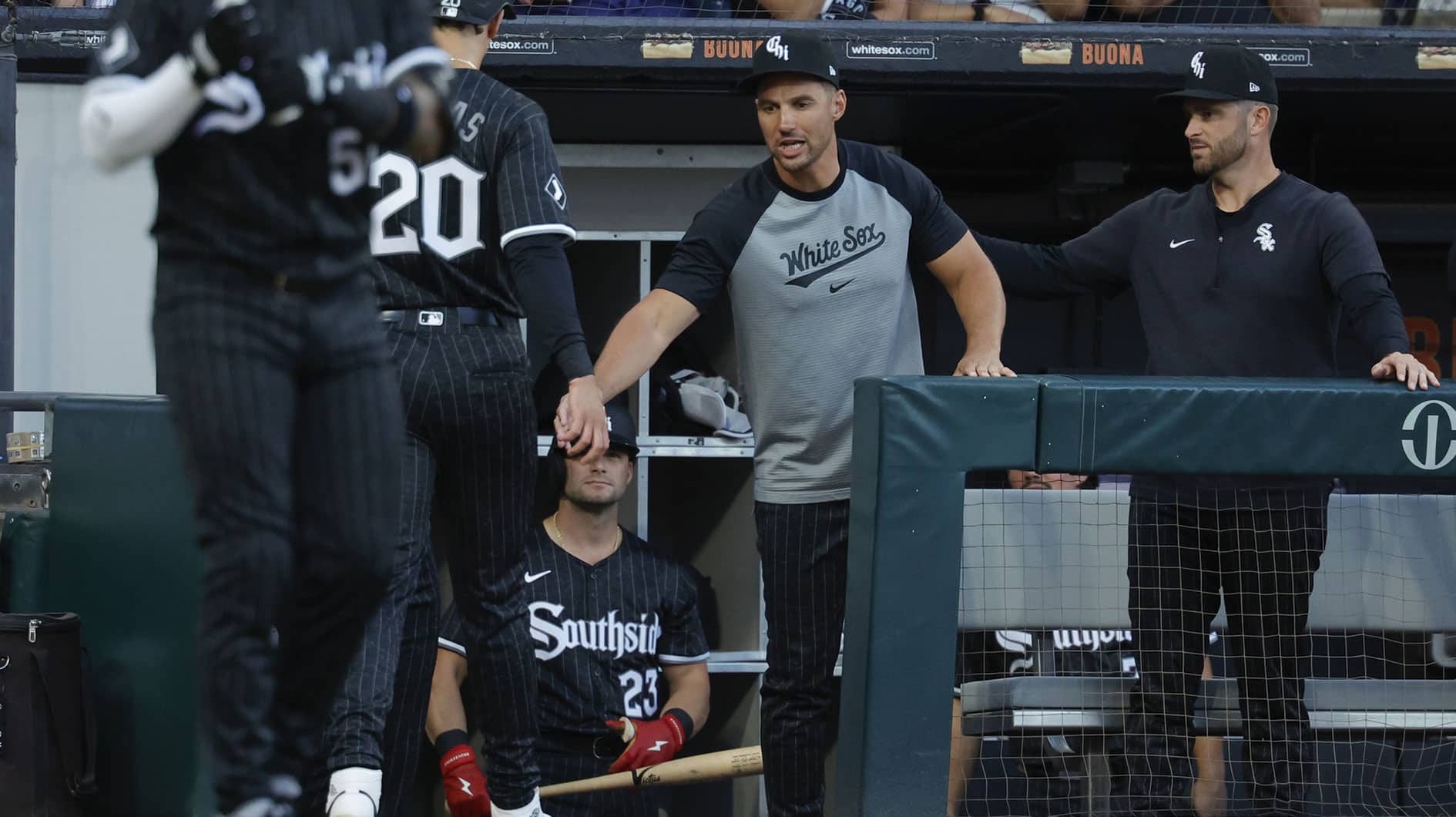 Aug 10, 2024; Chicago, Illinois, USA; Chicago White Sox interim manager Grady Sizemore (24) congratulates outfielder Miguel Vargas (20) after he scored against the Chicago Cubs during the second inning at Guaranteed Rate Field. Mandatory Credit: Kamil Krzaczynski-USA TODAY Sports