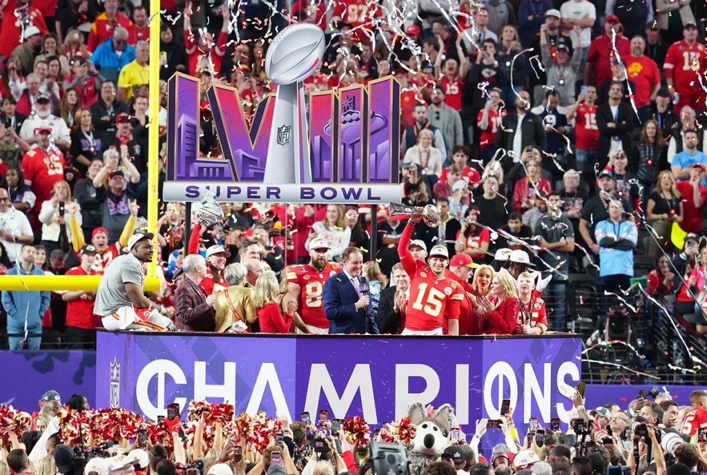 Kansas City Chiefs quarterback Patrick Mahomes (15) hoists the Vince Lombardi Trophy after defeating the San Francisco 49ers in Super Bowl LVIII at Allegiant Stadium