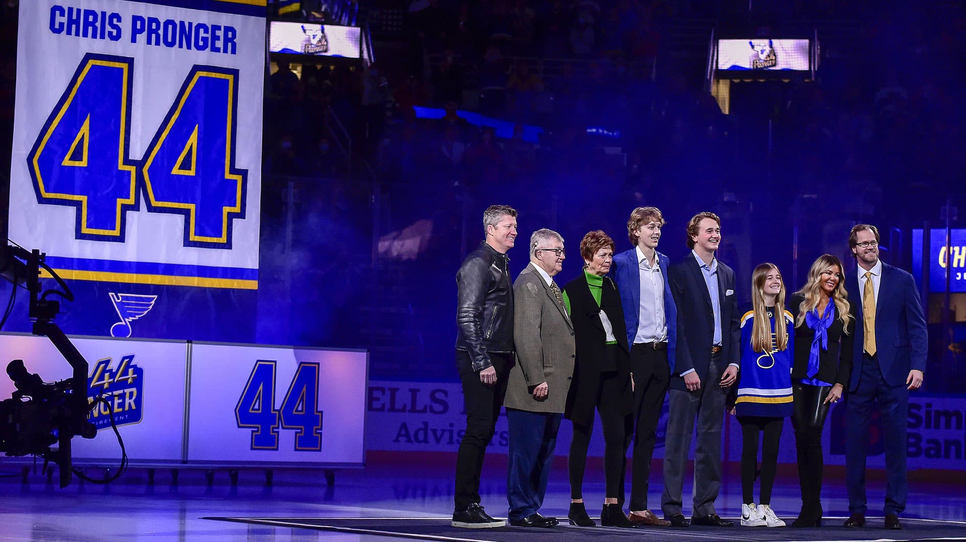 Former St. Louis Blues defenseman Chris Pronger (44) and his family pose for a photo as his jersey is retired prior to a game between the St. Louis Blues and the Nashville Predators at Enterprise Center. 