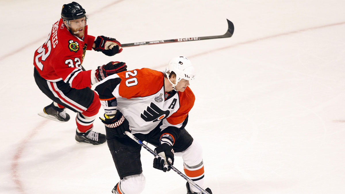 Philadelphia Flyers defenseman Chris Pronger (20) carries the puck away from Chicago Blackhawks right wing Kris Versteeg (32) during the first period in game one of the 2010 Stanley Cup Finals at the United Center.