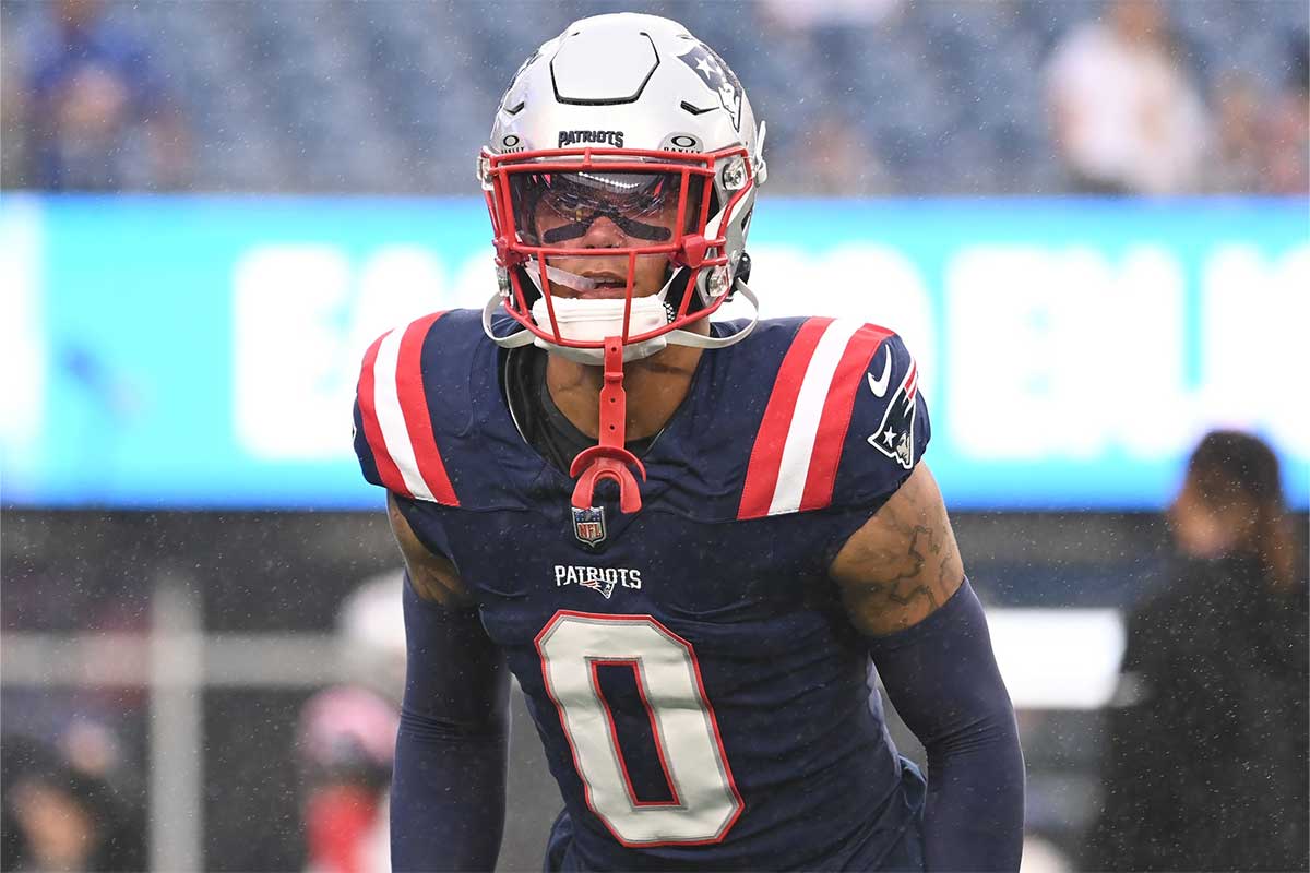 New England Patriots cornerback Christian Gonzalez (0) warms up before a game against the Carolina Panthers at Gillette Stadium