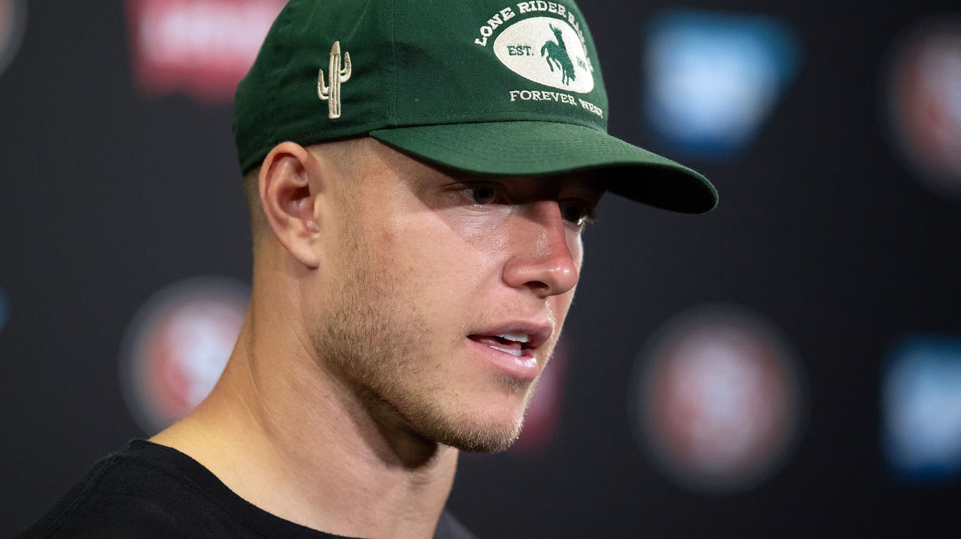 San Francisco 49ers running back Christian McCaffrey answers questions at a press conference following Day 3 of training camp at SAP Performance Facility.