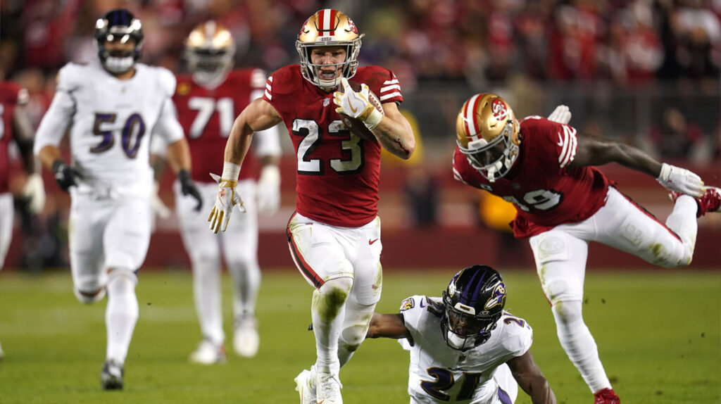  San Francisco 49ers running back Christian McCaffrey (23) runs the ball pressured by Baltimore Ravens cornerback Brandon Stephens (21) in the second quarter at Levi's Stadium. 