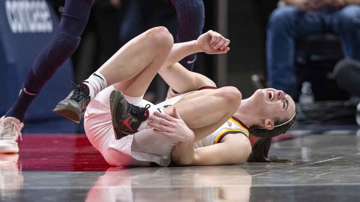 Indiana Fever guard Caitlin Clark (22) reacts after being injured during the first half of an WNBA basketball game against the Connecticut Sun, Monday, May 20, 2024, at Gainbridge Fieldhouse.