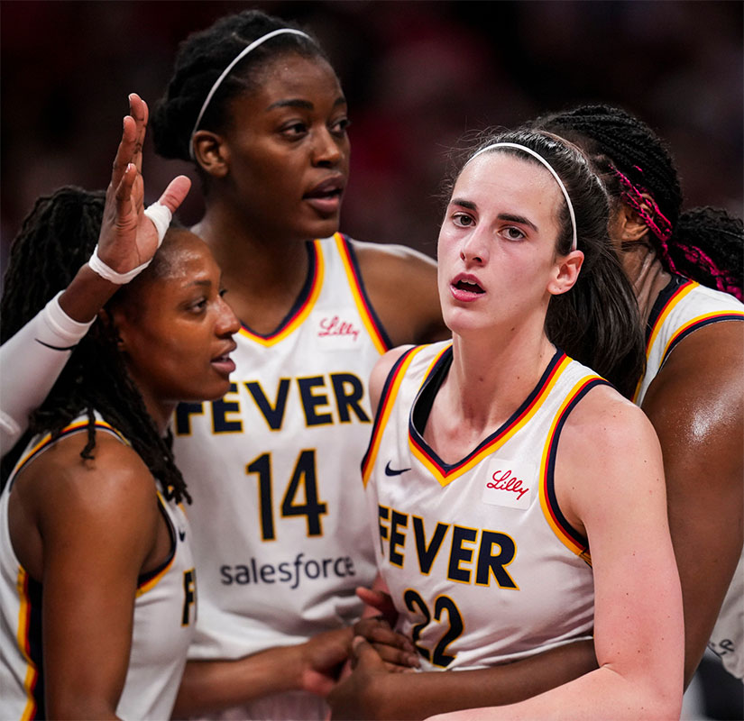 The Indiana Fever hold back Indiana Fever guard Caitlin Clark (22) on Wednesday, Aug. 28, 2024, during a game between the Indiana Fever and the Connecticut Sun at Gainbridge Fieldhouse in Indianapolis. The Fever defeated the Sun, 84-80.