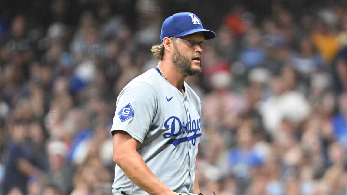 Los Angeles Dodgers pitcher Clayton Kershaw (22) walks off the field after Los Angeles Dodgers manager Dave Roberts (30) took him out of the game in the sixth inning against the Milwaukee Brewers at American Family Field. 