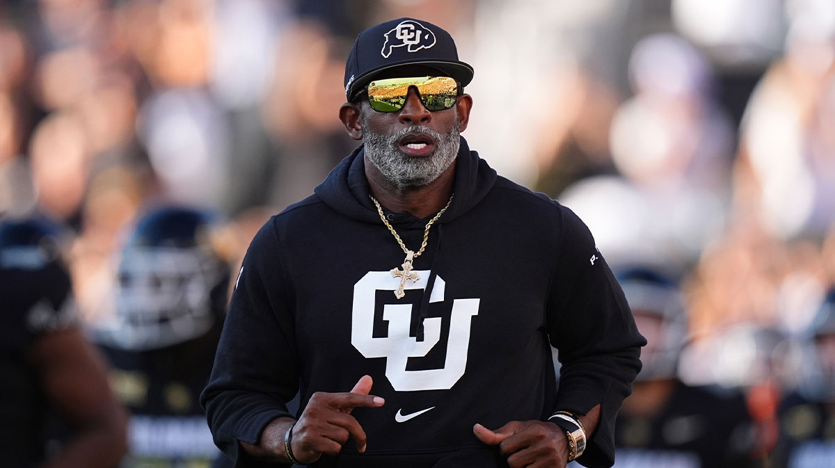 Colorado Buffaloes head coach Deion Sanders runs onto the field before the game against the North Dakota State Bison at Folsom Field.