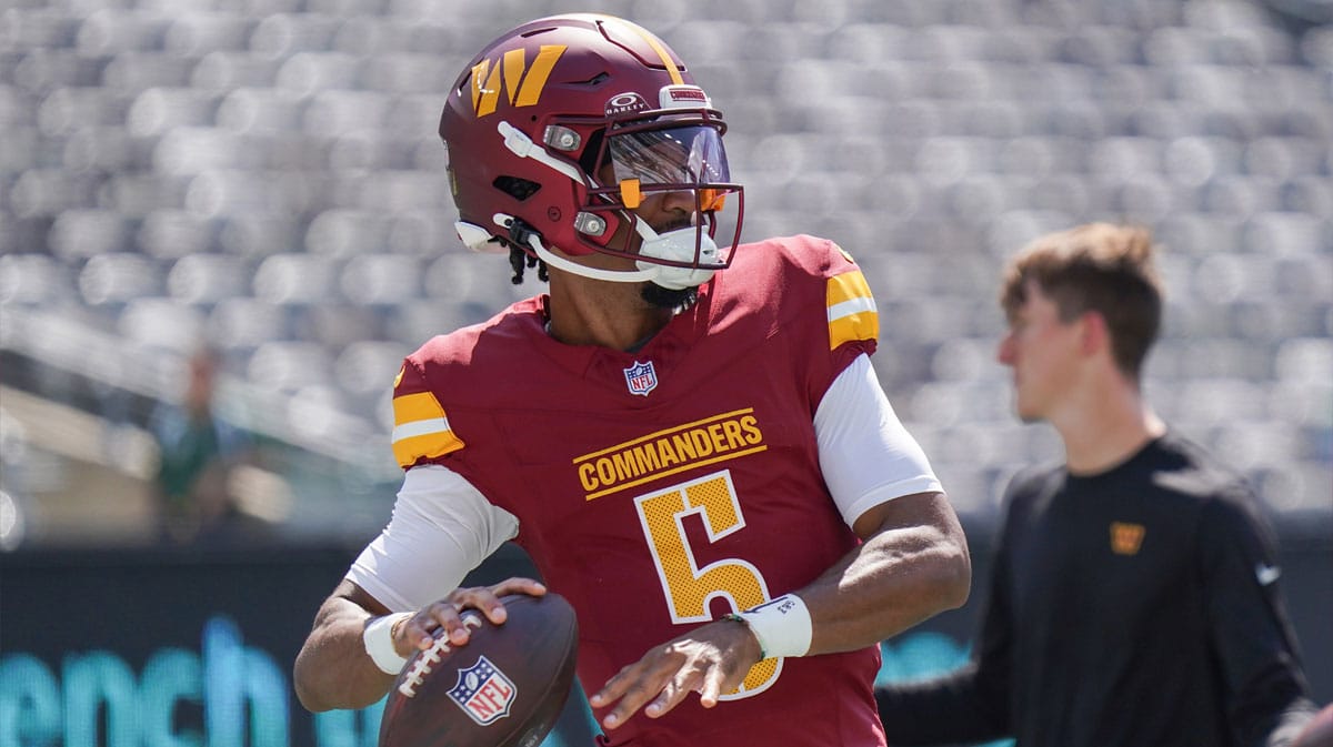 Washington Commanders quarterback Jayden Daniels (5) warms up before the game against the New York Jets at MetLife Stadium.