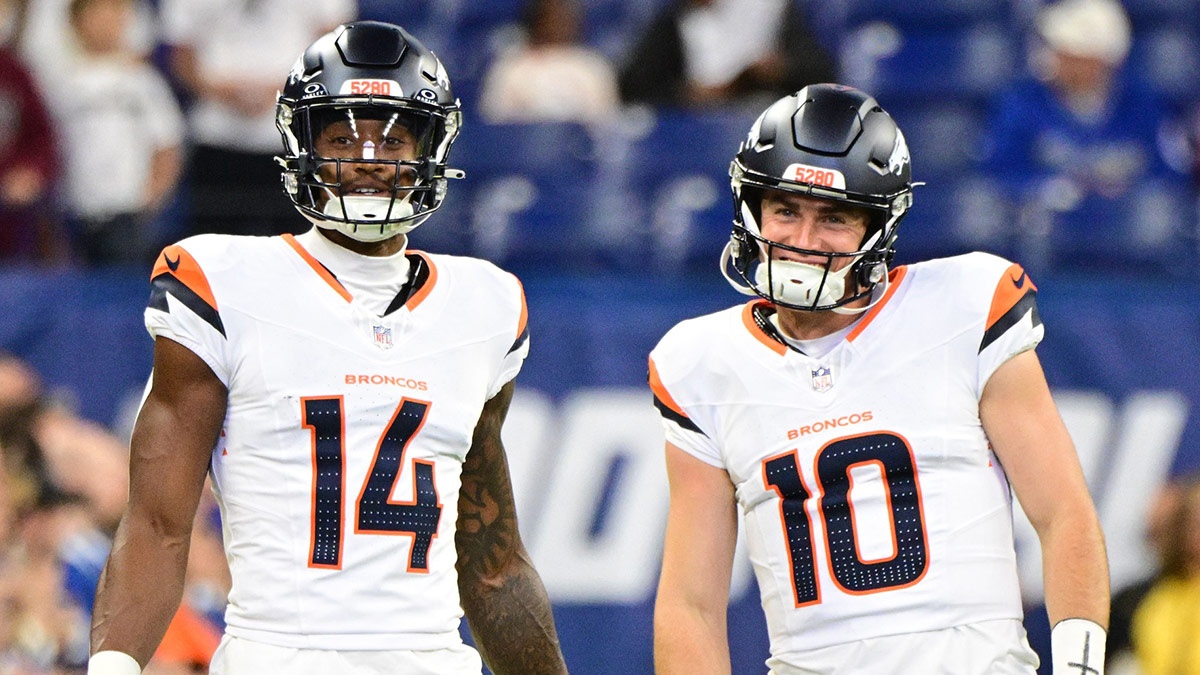 Denver Broncos wide receiver Courtland Sutton (14) and quarterback Bo Nix (10) stand on the field during warm ups before the game against the Indianapolis Colts at Lucas Oil Stadium.