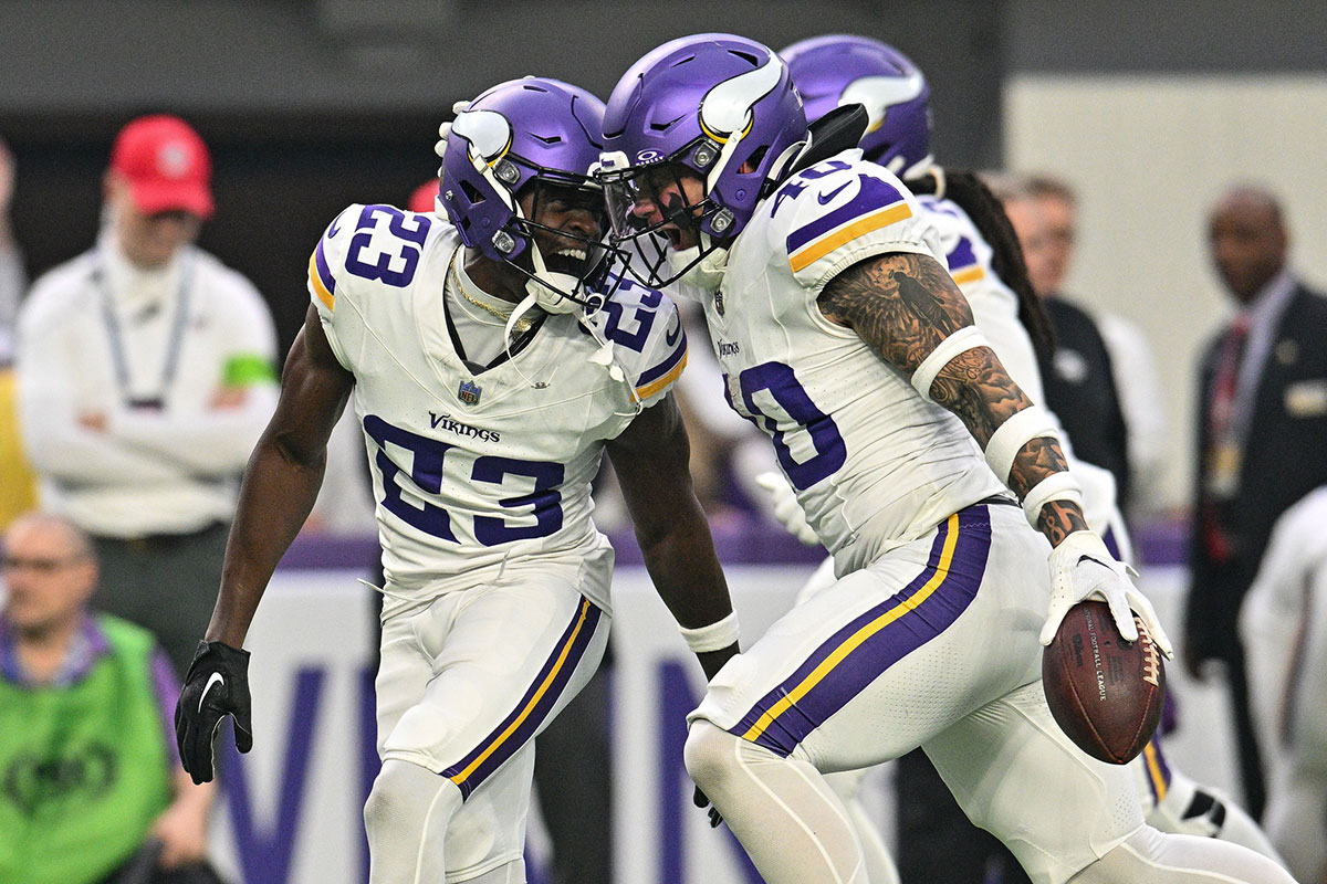 Minnesota Vikings cornerback Andrew Booth Jr. (23) and linebacker Ivan Pace Jr. (40) react after a fumble recovery against the Detroit Lions during the game at U.S. Bank Stadium. 