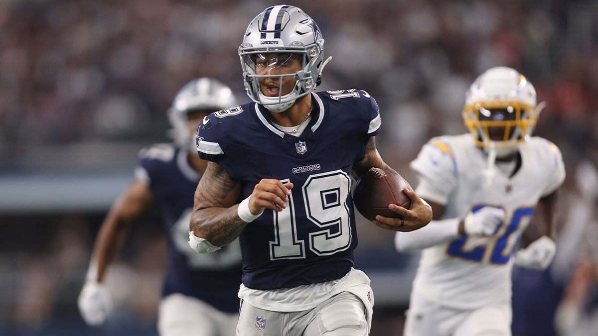 Dallas Cowboys quarterback Trey Lance (19) runs for a touchdown against the Los Angeles Chargers in the third quarter at AT&T Stadium.