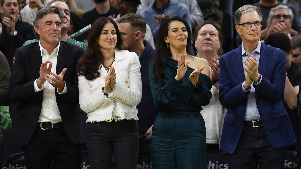 Boston Celtics owner Wyc Grousbeck (left) and his wife Emilia Fazzalari applaud with Boston Red Sox owner John Henry (right) and his wife Linda Pizzuti Henry during the second quarter of the game between the Boston Celtics and the Miami Heat at TD Garden.