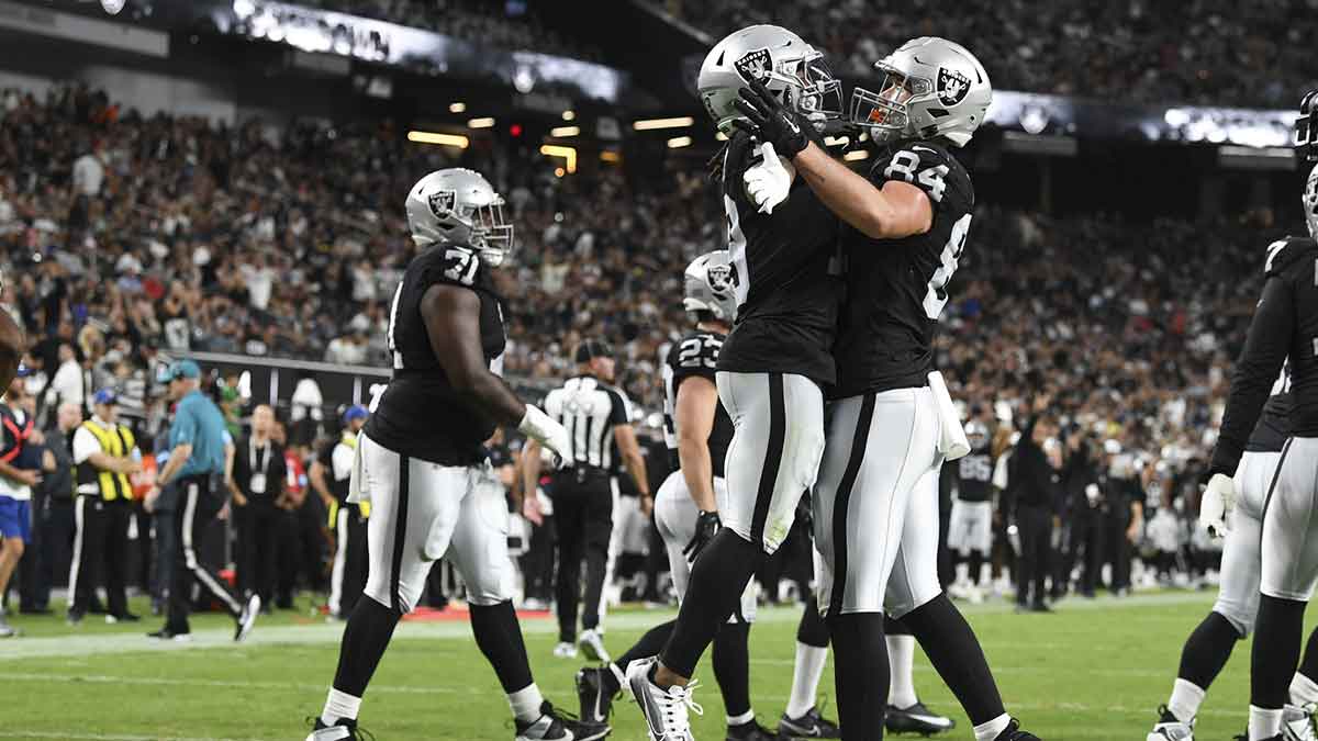 Aug 17, 2024; Paradise, Nevada, USA; Las Vegas Raiders tight end Harrison Bryant (84) celebrates his touchdown with wide receiver DJ Turner (19) in the third quarter against the Dallas Cowboys at Allegiant Stadium.