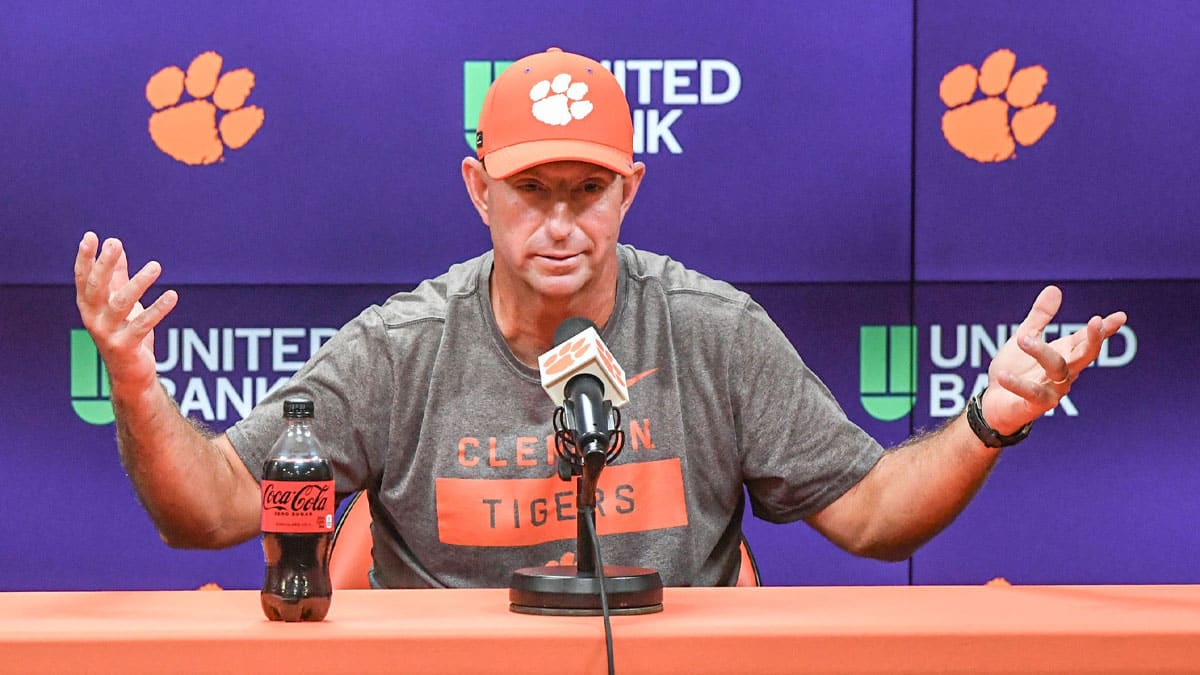 Clemson head coach Dabo Swinney talks with media before the Clemson first football August practice