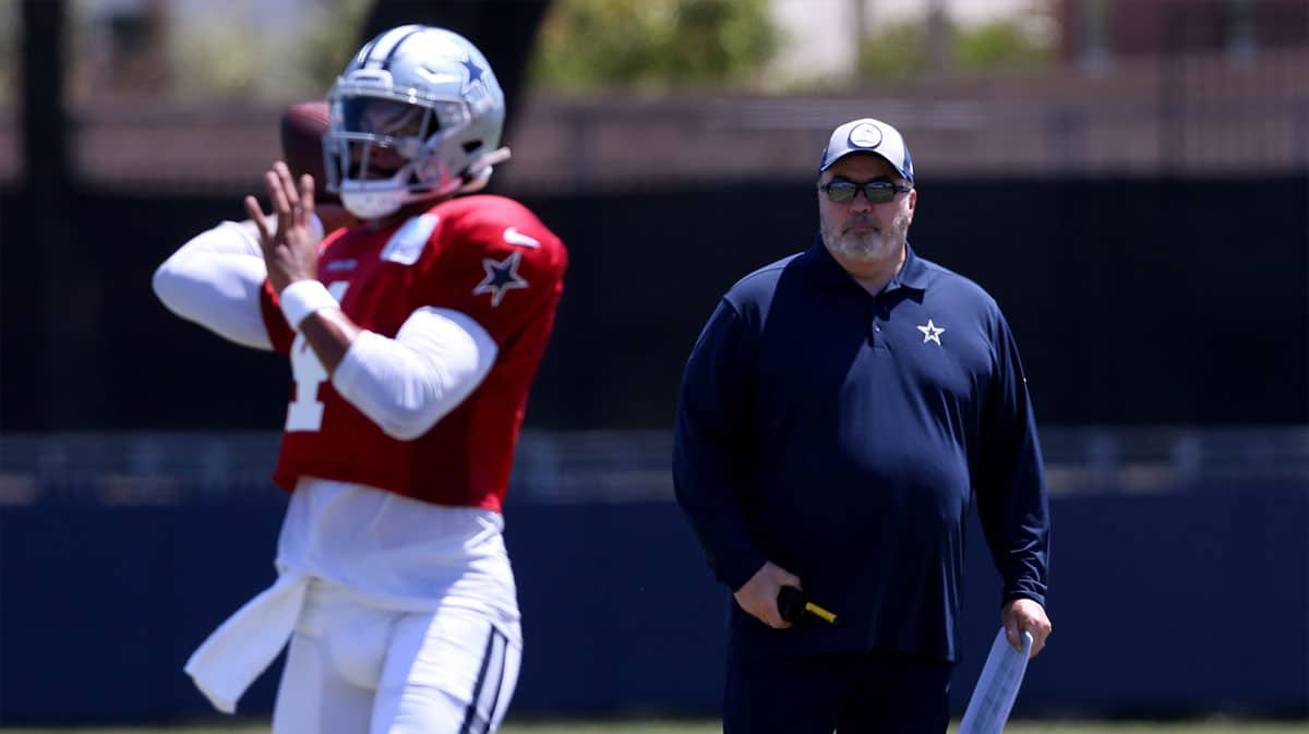 Dallas Cowboys head coach Mike McCarthy watches quarterback Dak Prescott (4) during training camp at the River Ridge Playing Fields in Oxnard, California. 