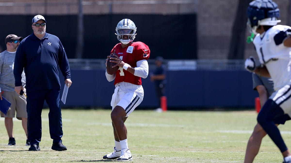 Dallas Cowboys head coach Mike McCarthy watches quarterback Dak Prescott (4) during training camp at the River Ridge Playing Fields in Oxnard, California.