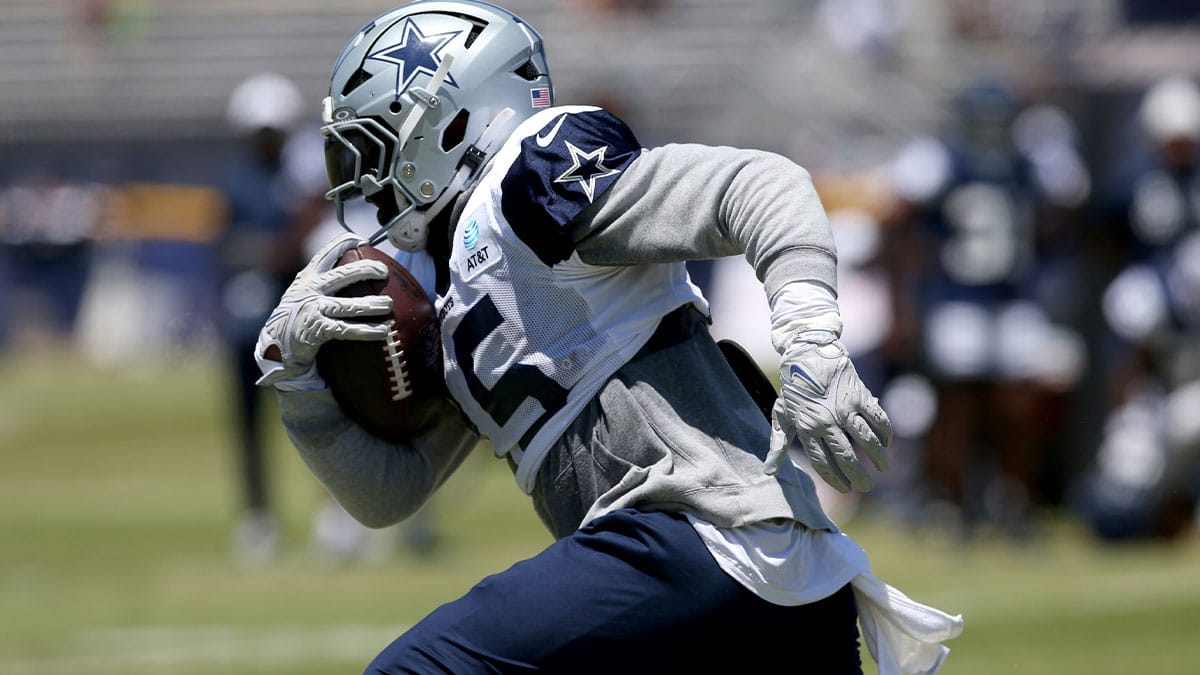 Dallas Cowboys running back Ezekiel Elliott (15) runs during training camp at the River Ridge Playing Fields in Oxnard, California. 