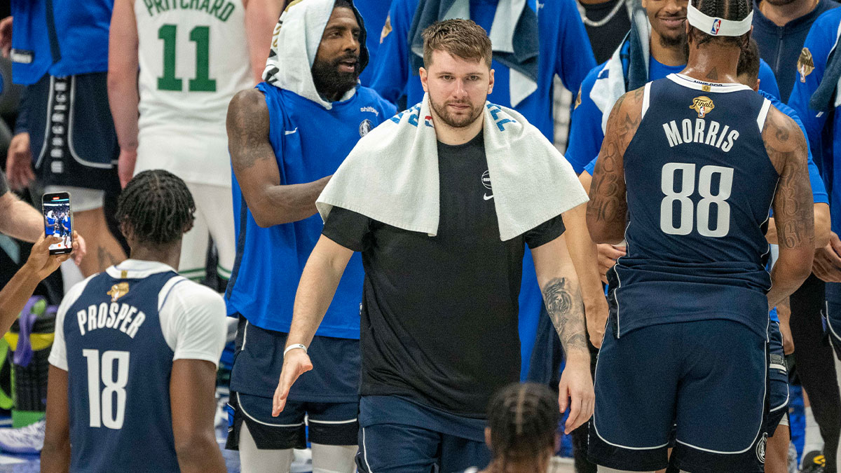 Dallas Mavericks guard Luka Doncic (77) and guard Kyrie Irving (11) leave the court after the Mavericks defeated the Boston Celtics in game four of the 2024 NBA Finals at the American Airlines Center. 