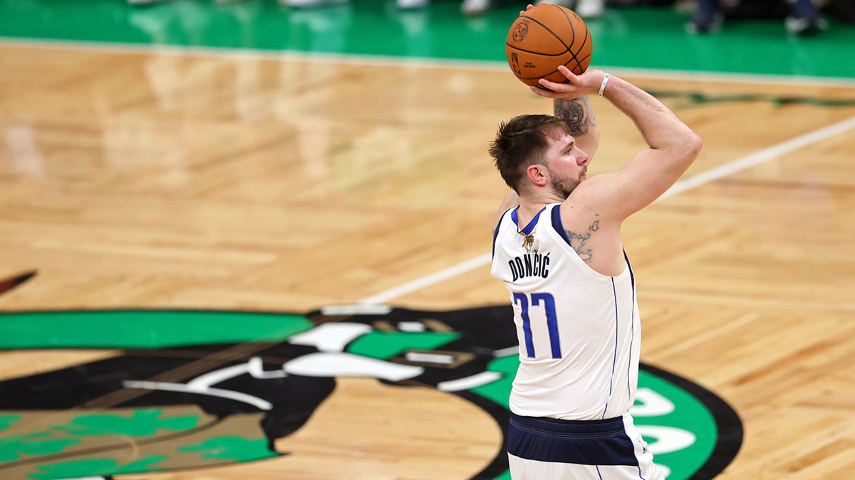 Dallas Mavericks guard Luka Doncic (77) shoots the ball against the Boston Celtics during the third quarter in game five of the 2024 NBA Finals at TD Garden.