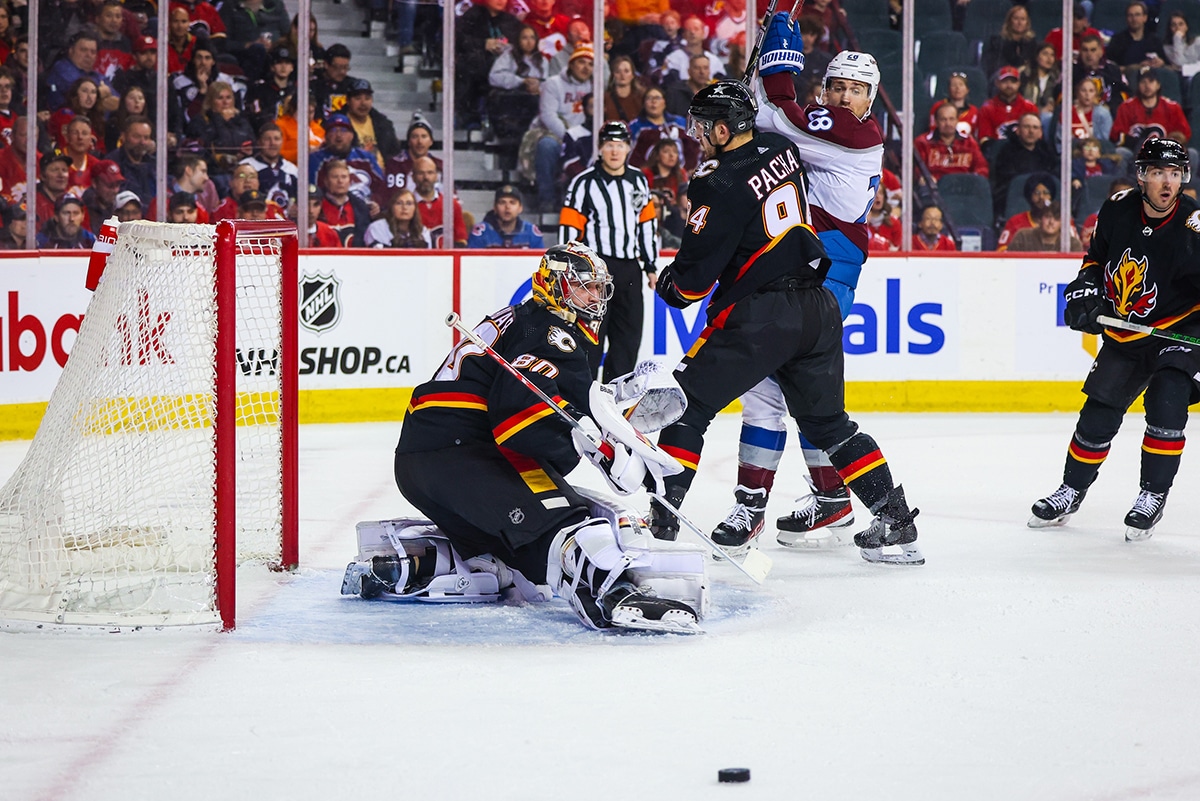 Calgary Flames goaltender Dan Vladar (80) makes a save against the Colorado Avalanche during the first period at Scotiabank Saddledome.