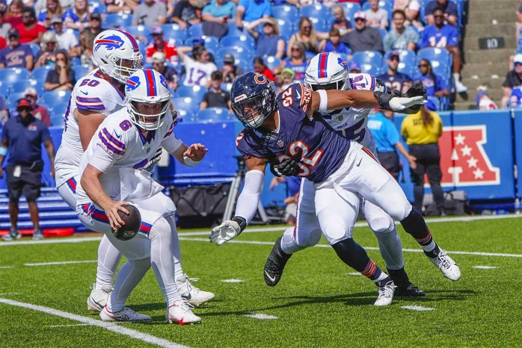 Chicago Bears defensive end Daniel Hardy (92) pursues Buffalo Bills quarterback Shane Buechele (6) during the second half at Highmark Stadium