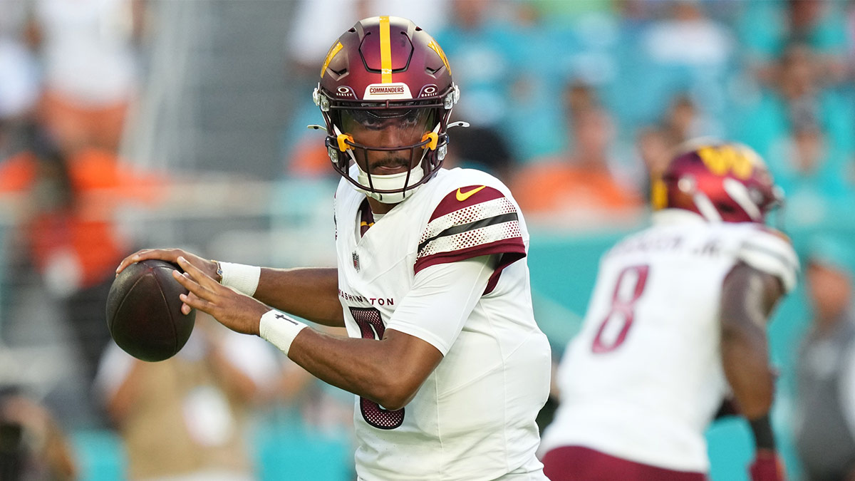 Washington Commanders quarterback Jayden Daniels (5) drops back to pass against the Miami Dolphins during the first quarter at Hard Rock Stadium.