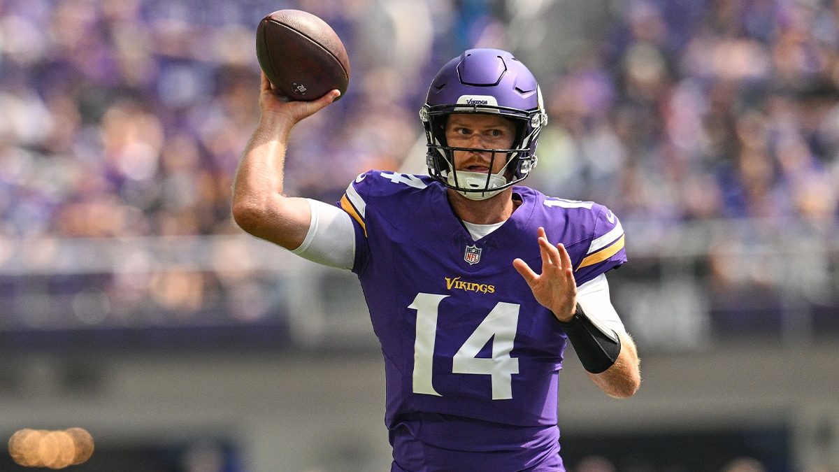 Minnesota Vikings quarterback Sam Darnold (14) throws a pass against the Las Vegas Raiders during the first quarter at U.S. Bank Stadium. 