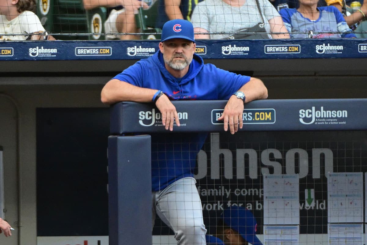 Chicago Cubs manager David Ross looks on from the dugout in the eighth inning during game against the Milwaukee Brewers at American Family Field.