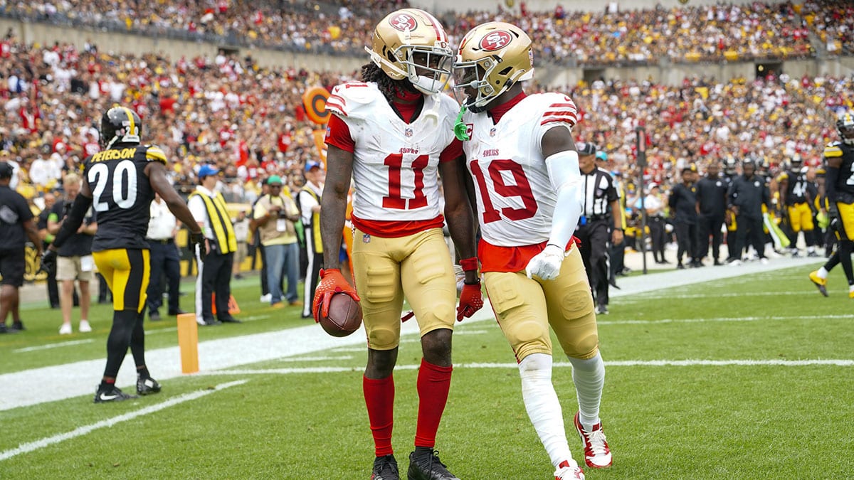 San Francisco 49ers wide receiver Deebo Samuel (19) congratulates San Francisco 49ers wide receiver Brandon Aiyuk (11) for catching a touchdown pass against the Pittsburgh Steelers during the first half at Acrisure Stadium.