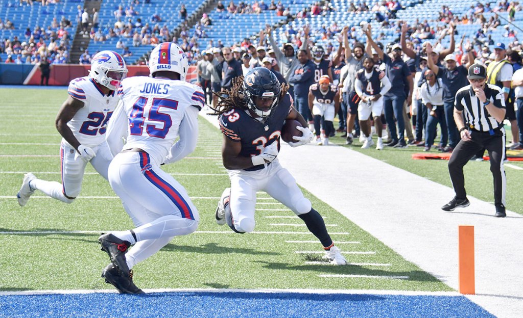 Chicago Bears running back Ian Wheeler (33) beats Buffalo Bills linebacker Deion Jones (45) in the end zone and scores a touchdown in the fourth quarter of a preseason game at Highmark Stadium. 