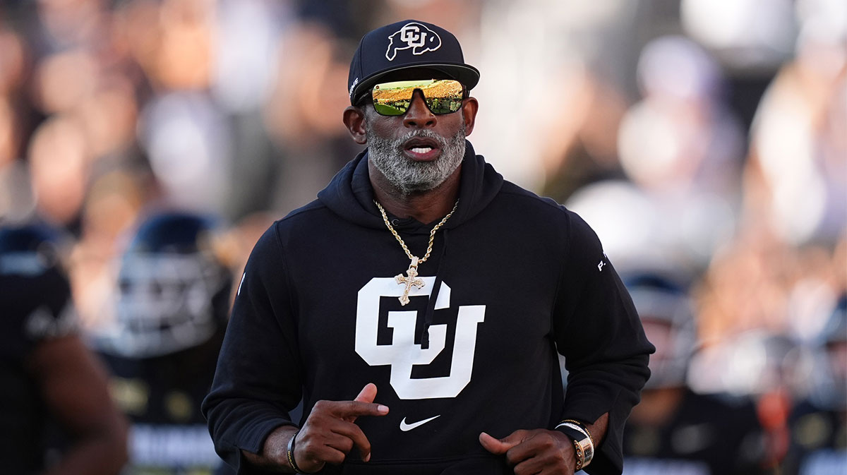 Colorado Buffaloes head coach Deion Sanders runs onto the field before the game against the North Dakota State Bison at Folsom Field.