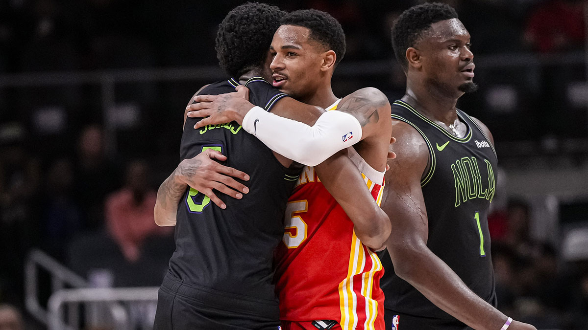 New Orleans Pelicans forward Herbert Jones (5) and Atlanta Hawks guard Dejounte Murray (5) react together after the game at State Farm Arena. 