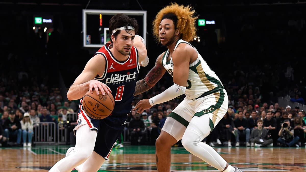 Apr 14, 2024; Boston, Massachusetts, USA; Washington Wizards forward Deni Avdija (8) dribbles while Boston Celtics guard JD Davison (20) defends during the first half at TD Garden. 