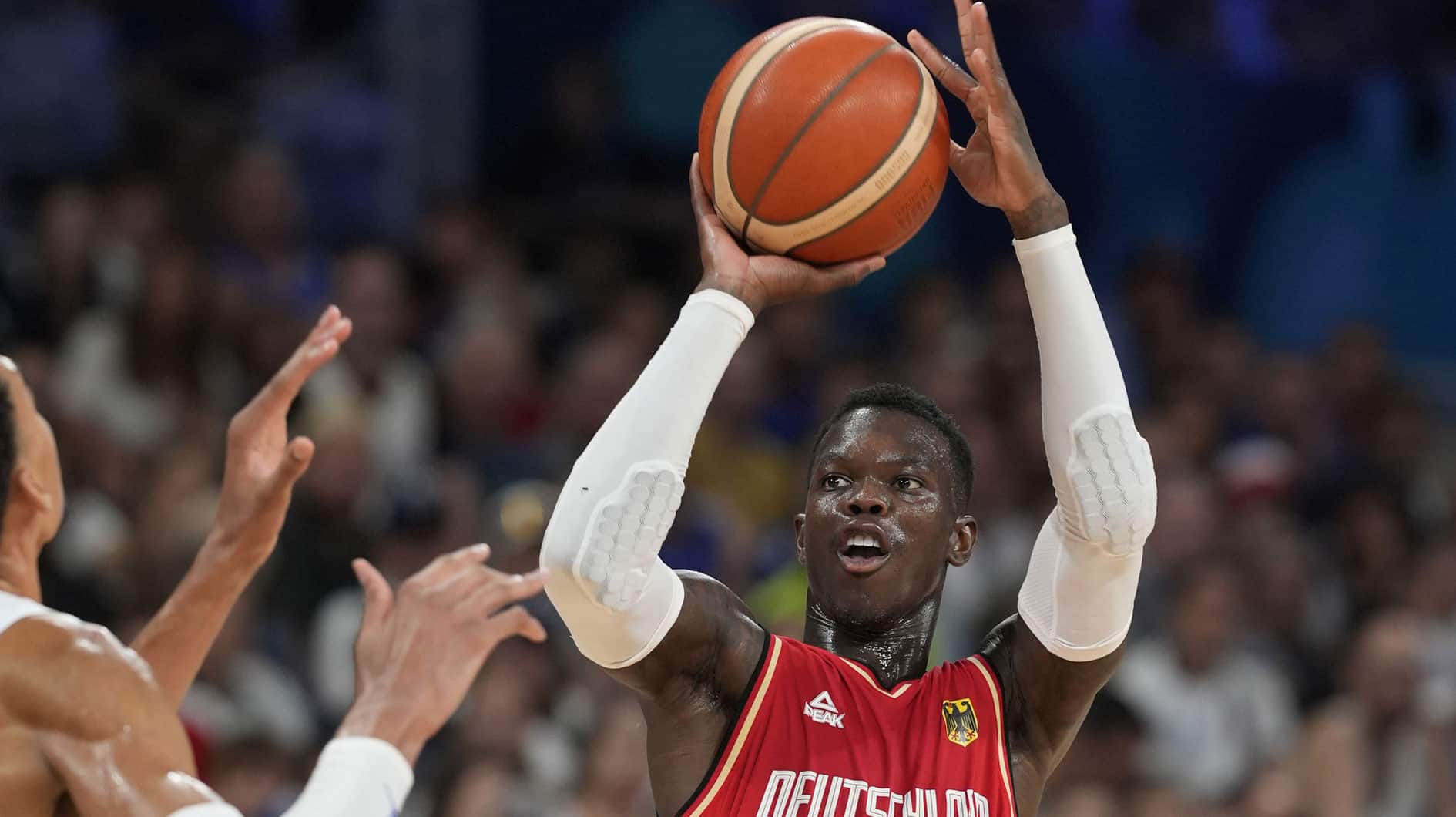 Dennis Schroder (17) shoots against France power forward Victor Wembanyama (32)