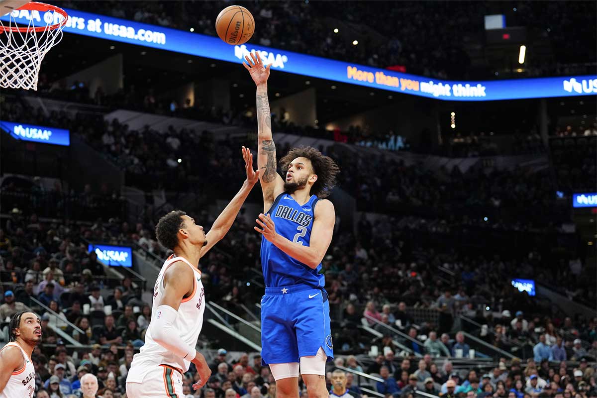 Dallas Mavericks center Dereck Lively II (2) shoots over San Antonio Spurs center Victor Wembanyama (1) in the second half at Frost Bank Center.