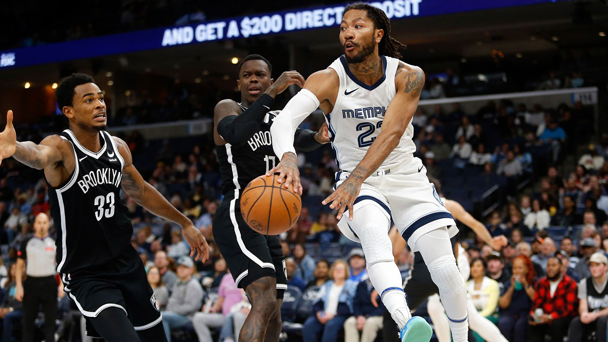 Memphis Grizzlies guard Derrick Rose (23) passes the ball during the first half against the Brooklyn Nets at FedExForum.