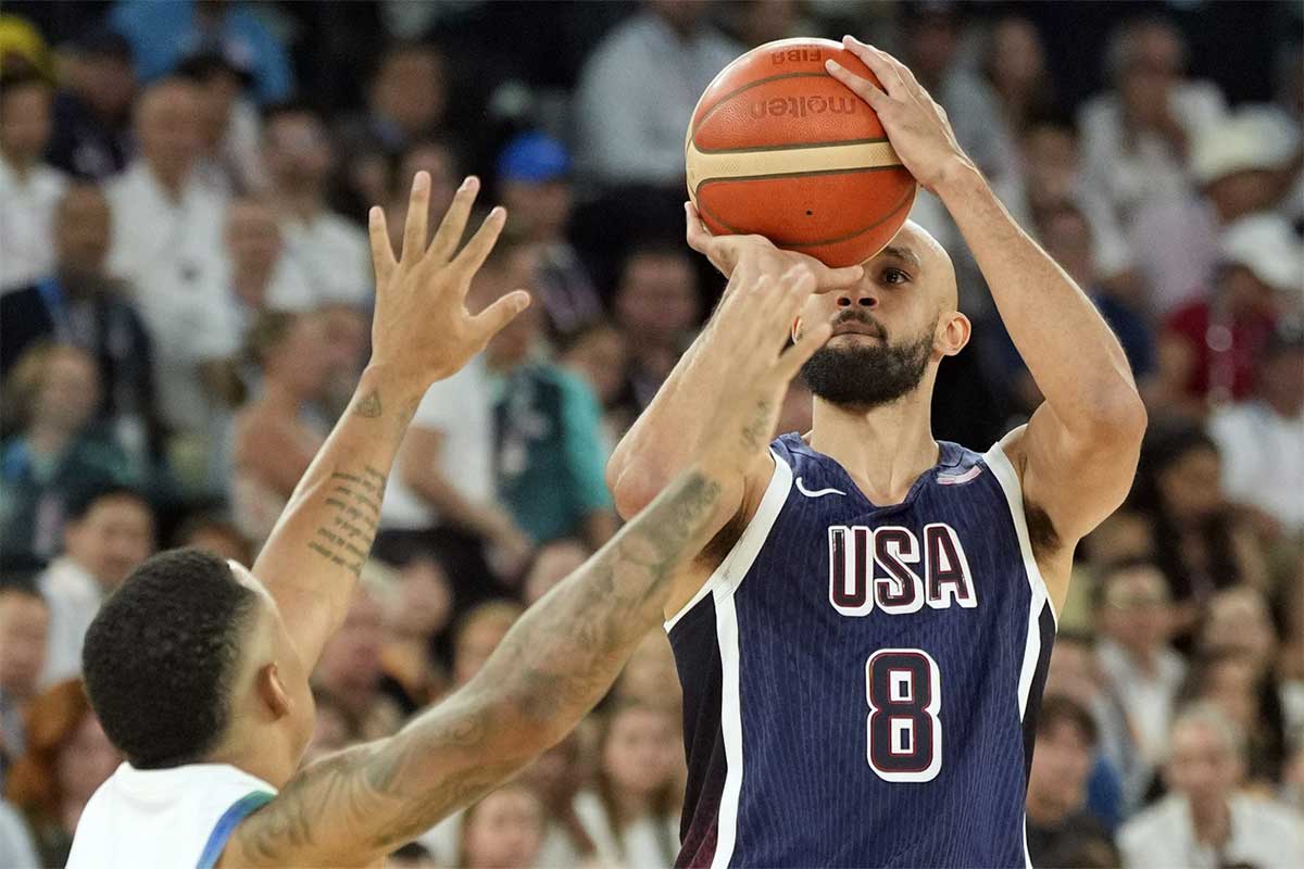 United States guard Derrick White (8) shoots against Brazil point guard Yago Santos (2) in the first half in a men’s basketball quarterfinal game during the Paris 2024 Olympic Summer Games at Accor Arena.