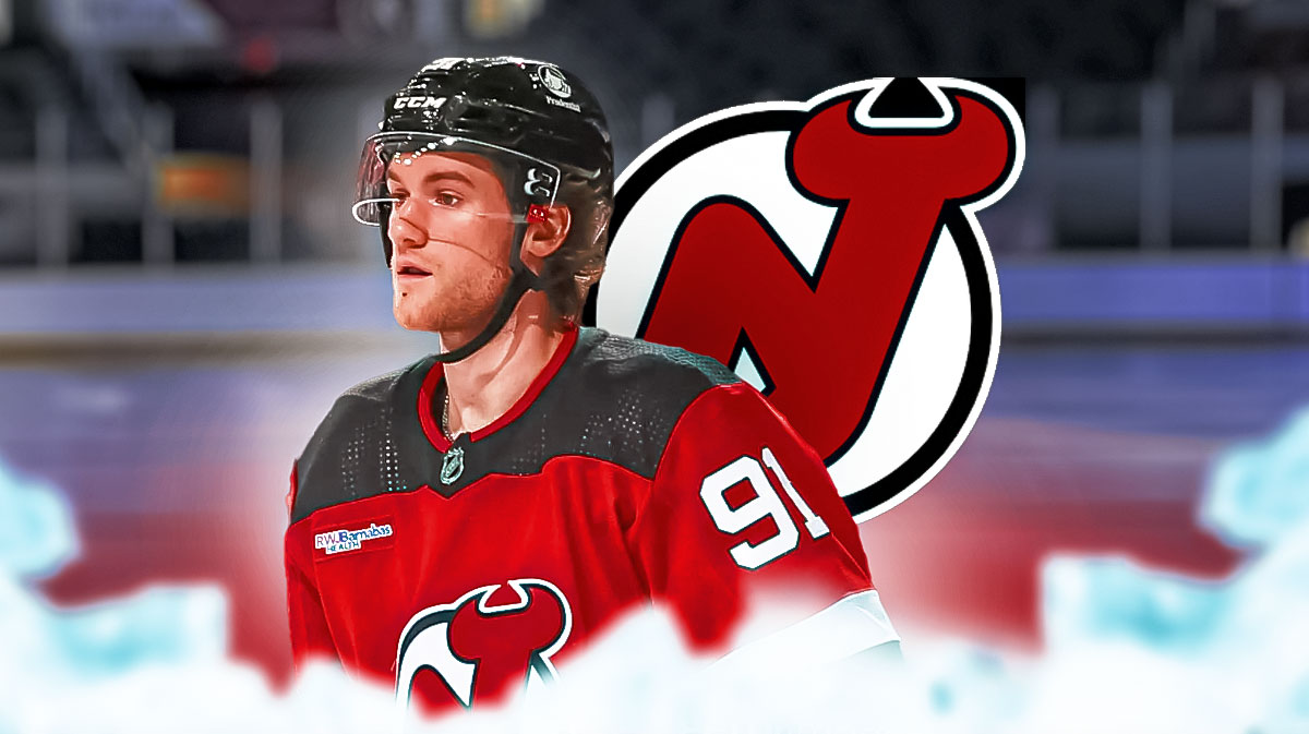 Dawson Mercer in image looking stern, New Jersey Devils logo, hockey rink in background