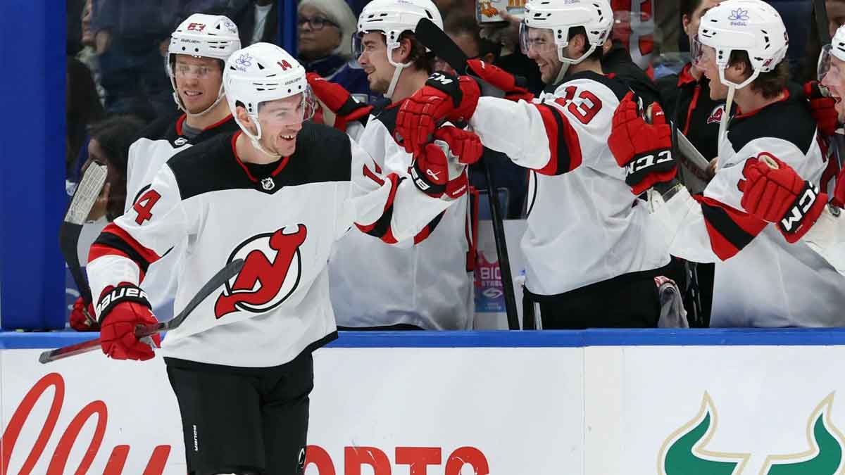 New Jersey Devils right wing Nathan Bastian (14) is congratulated after he scored a goal against the Tampa Bay Lightning during the third period at Amalie Arena.