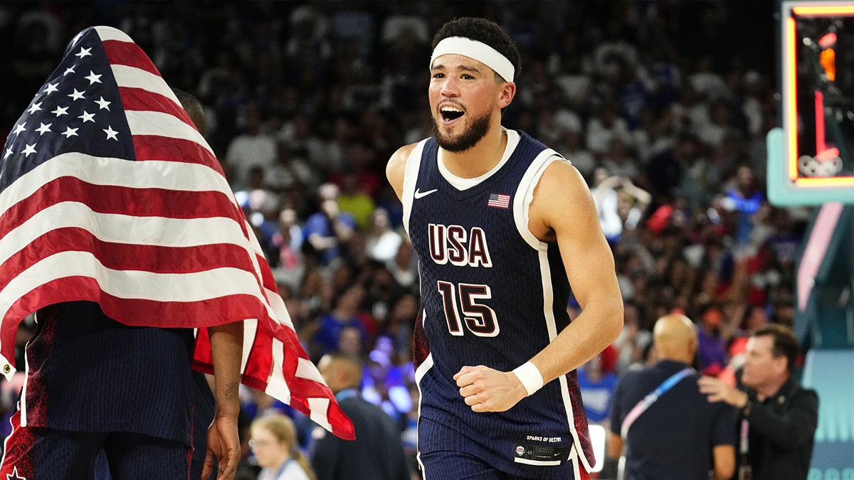 Team USA guard Devin Booker (15) celebrates after defeating France in the men's basketball gold medal game during the Paris 2024 Olympic Summer Games at Accor Arena.